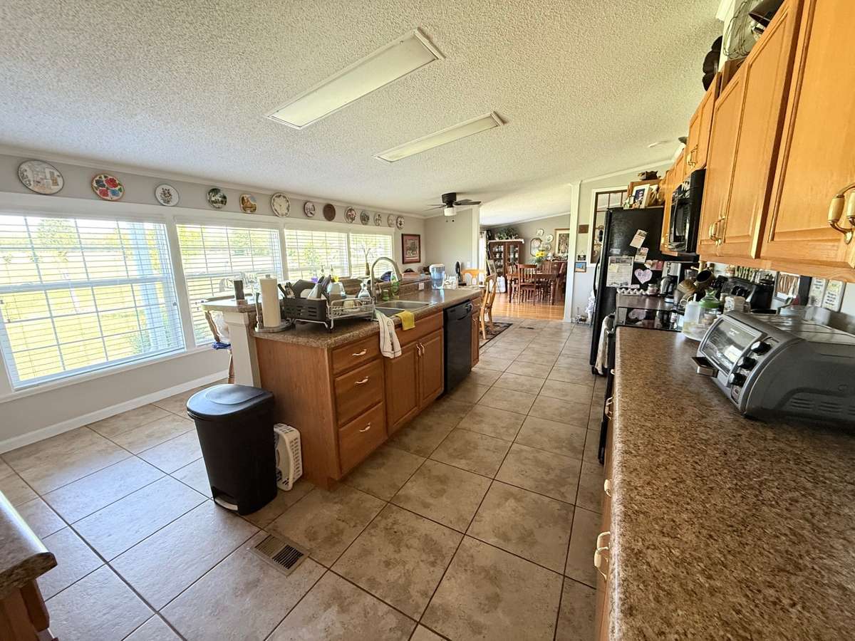 Kitchen has massive windows fir a great view of nature
