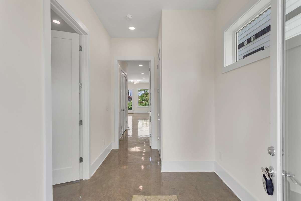 This entry way provides an opportunity to lock out the bottom primary suite from the rest of the home so that you may use for home office, mother-in-law, suite, college student, or Airbnb.