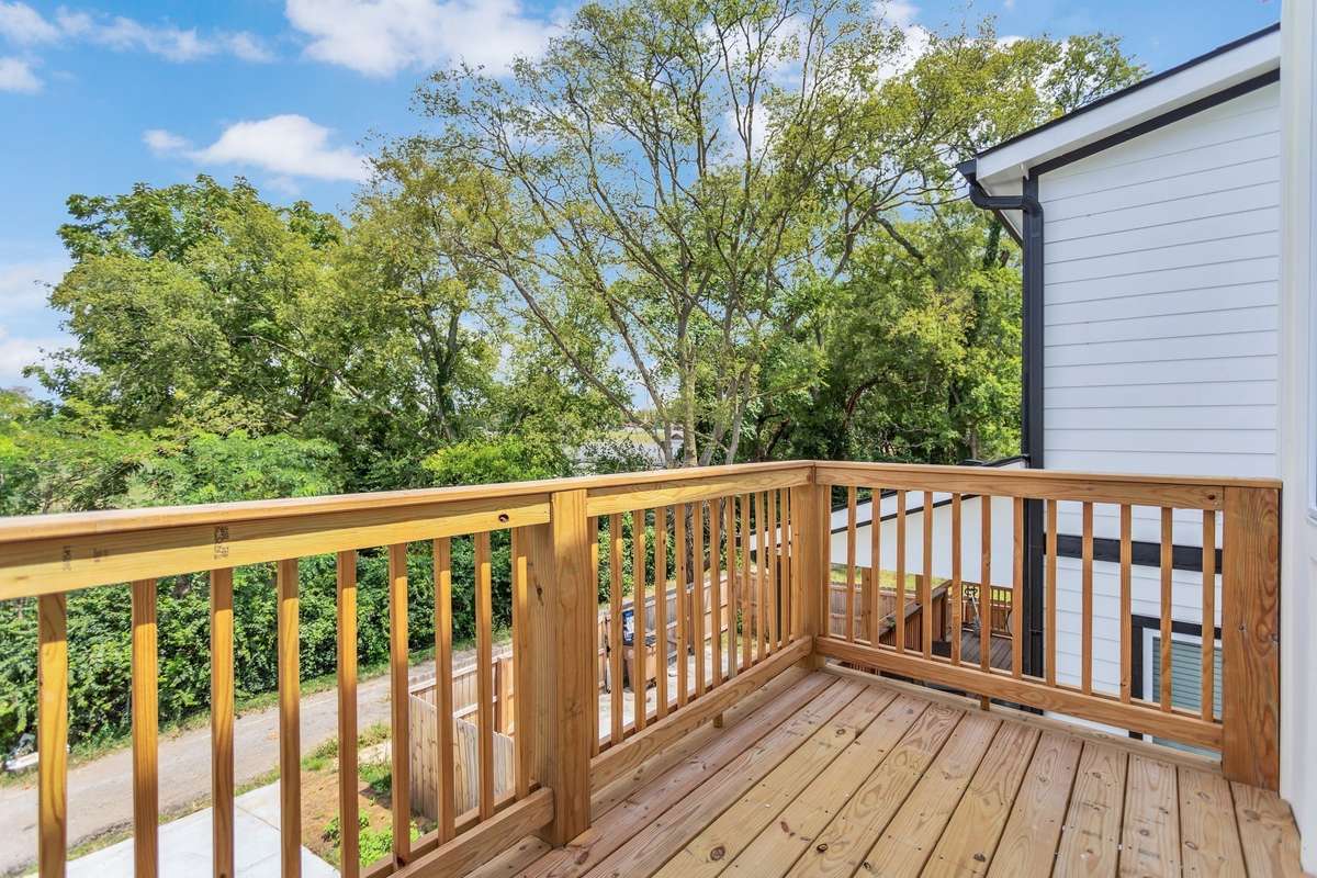 Balcony off of the primary upstairs bedroom is a peaceful place to sit and watch the sunset!