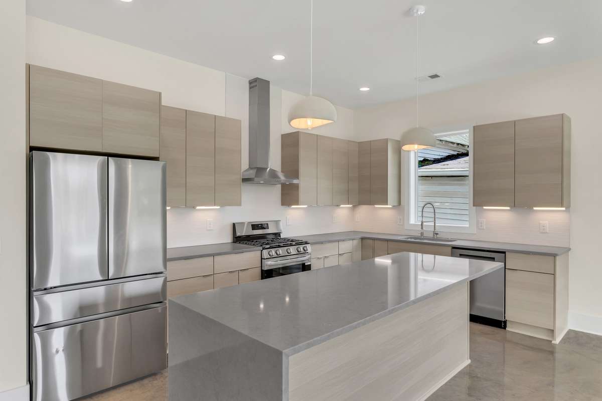 Flat front European cabinets, quartz countertops And 20 x 48 textured tile backsplash, make this a perfect chef’s kitchen!
