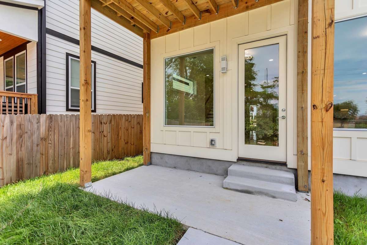Covered back porch shades you from the summer sun, so you may relax and overlook the lovely green space Church and park across the street.