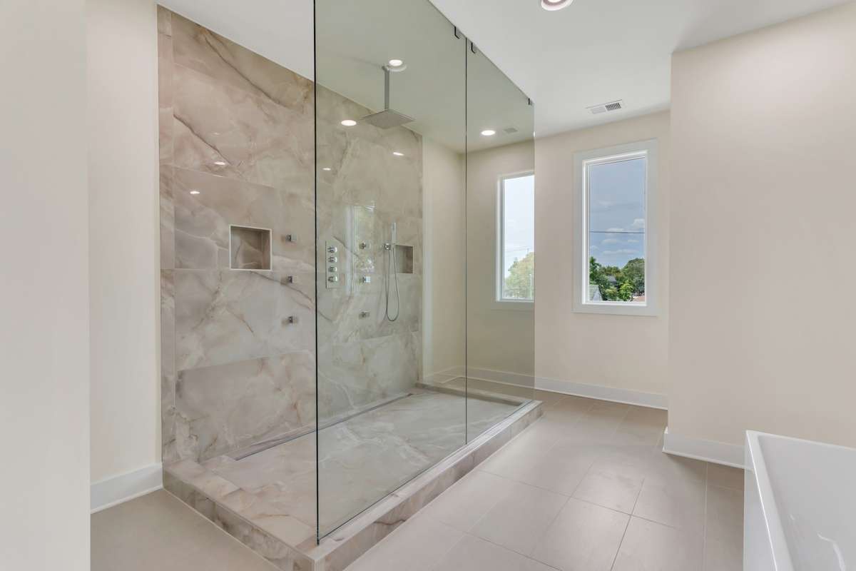 This huge walk-through shower upstairs with six body jets, 12 inch rain shower head, and handheld spray is more than enough space to enjoy your morning shower.