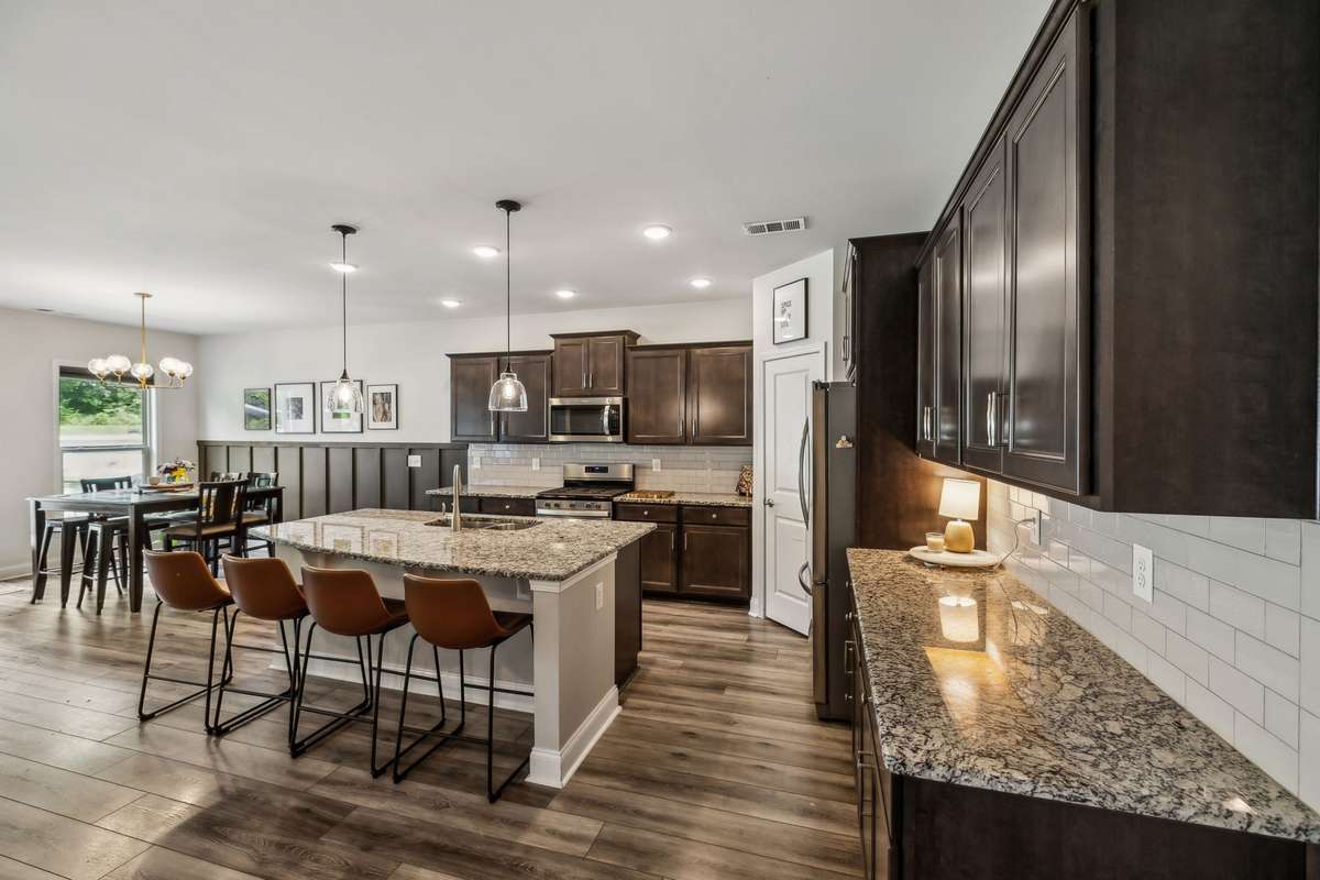 Open plan kitchen with island eating area, dining area and great layout