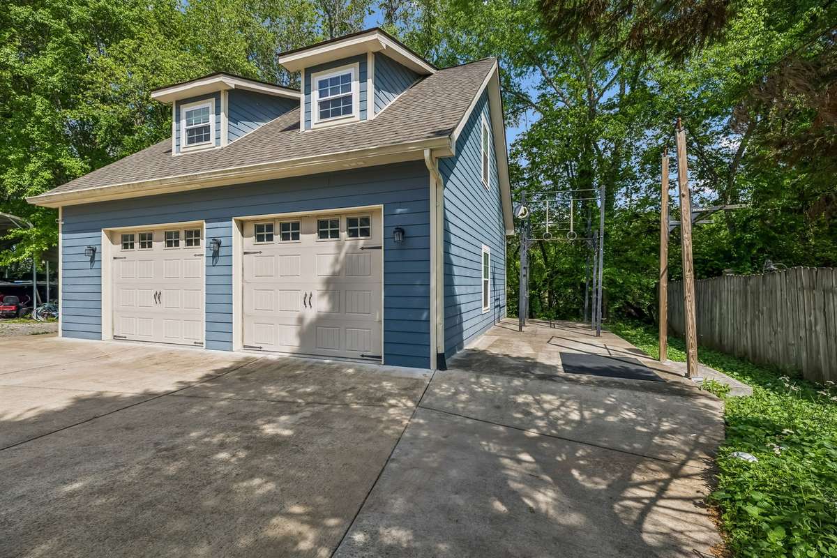 Two-bay detached garage with finished office space, gives you room for cars plus a real project area.