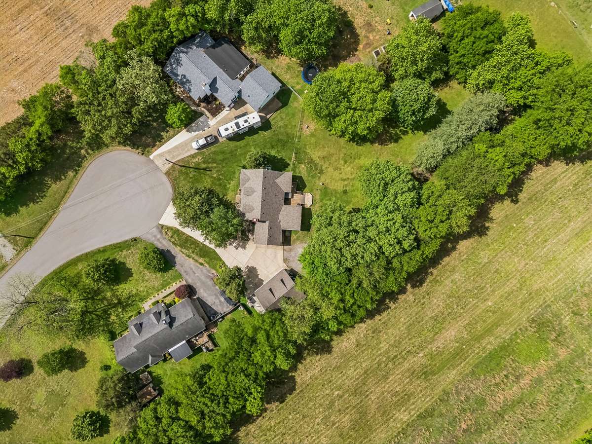 Property offers plenty of privacy tucked into mature trees with no HOA restrictions and generous space between neighbors.