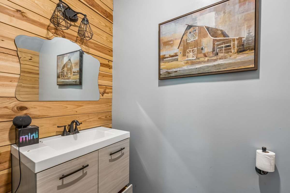 Half bathroom located in the detached garage/shop for convenience