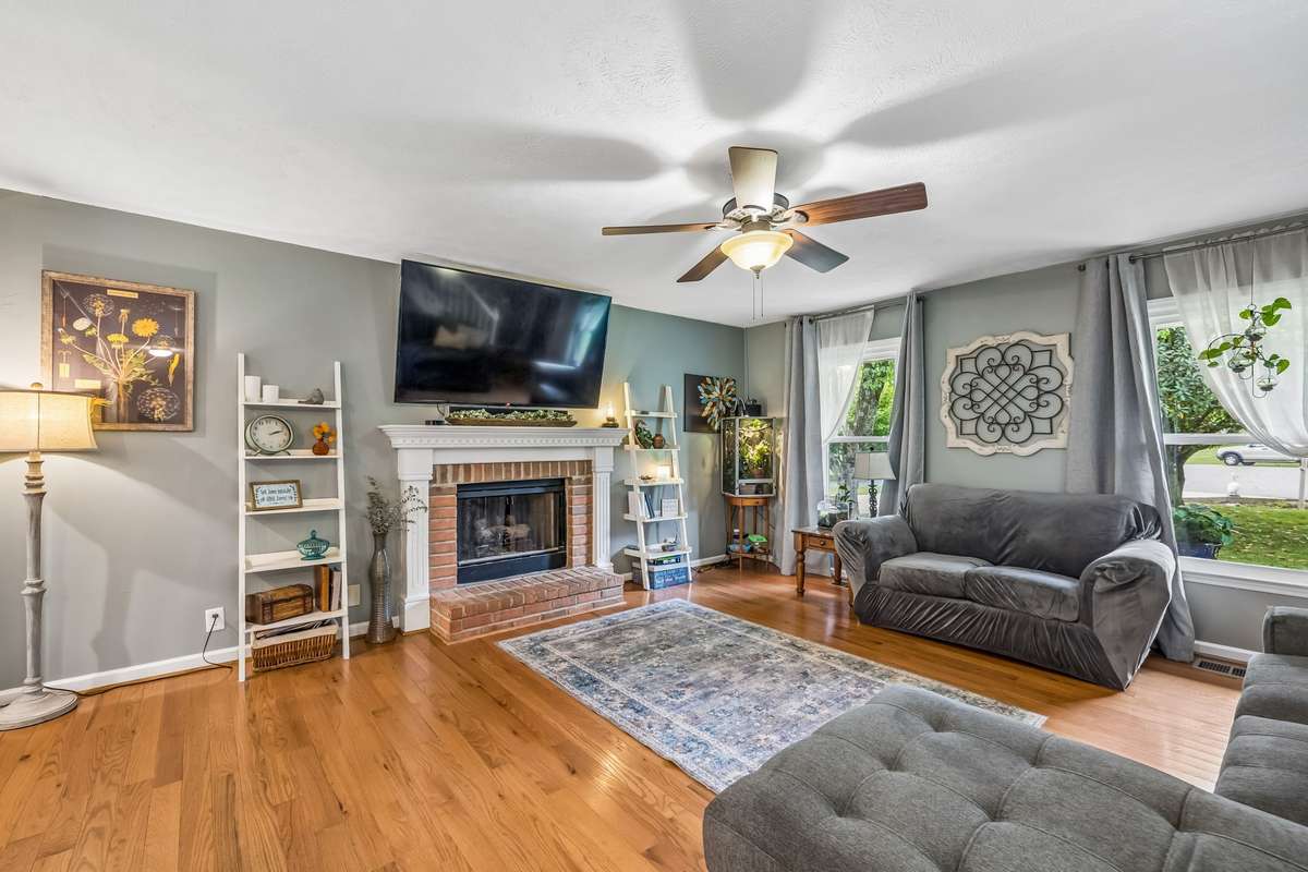 Brick fireplace makes the living room feel cozy.