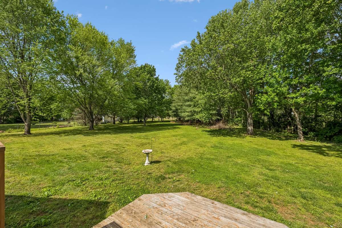 Level backyard extends well beyond the immediate yard area, giving you room for games, gardening, or just letting the dogs run.