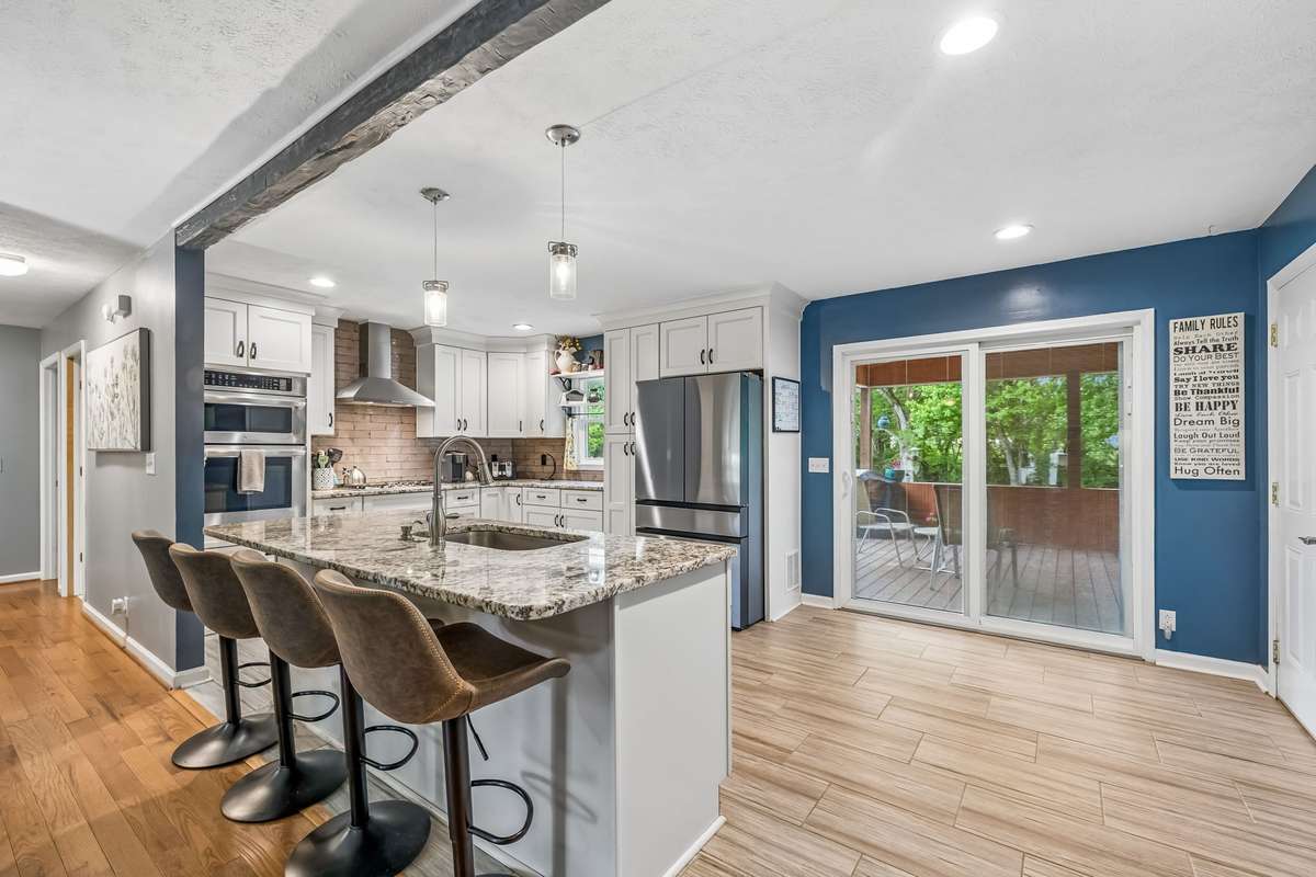 This open kitchen flows right into the main living space with a large island that keeps the cook part of the conversation.