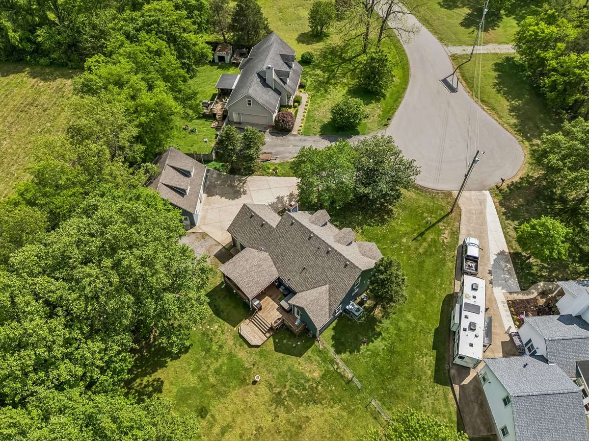 Property offers plenty of privacy tucked into mature trees with no HOA restrictions and generous space between neighbors.