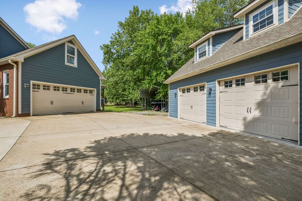 Detached garage with two bays plus the office space upstairs, smart setup for storage and projects.