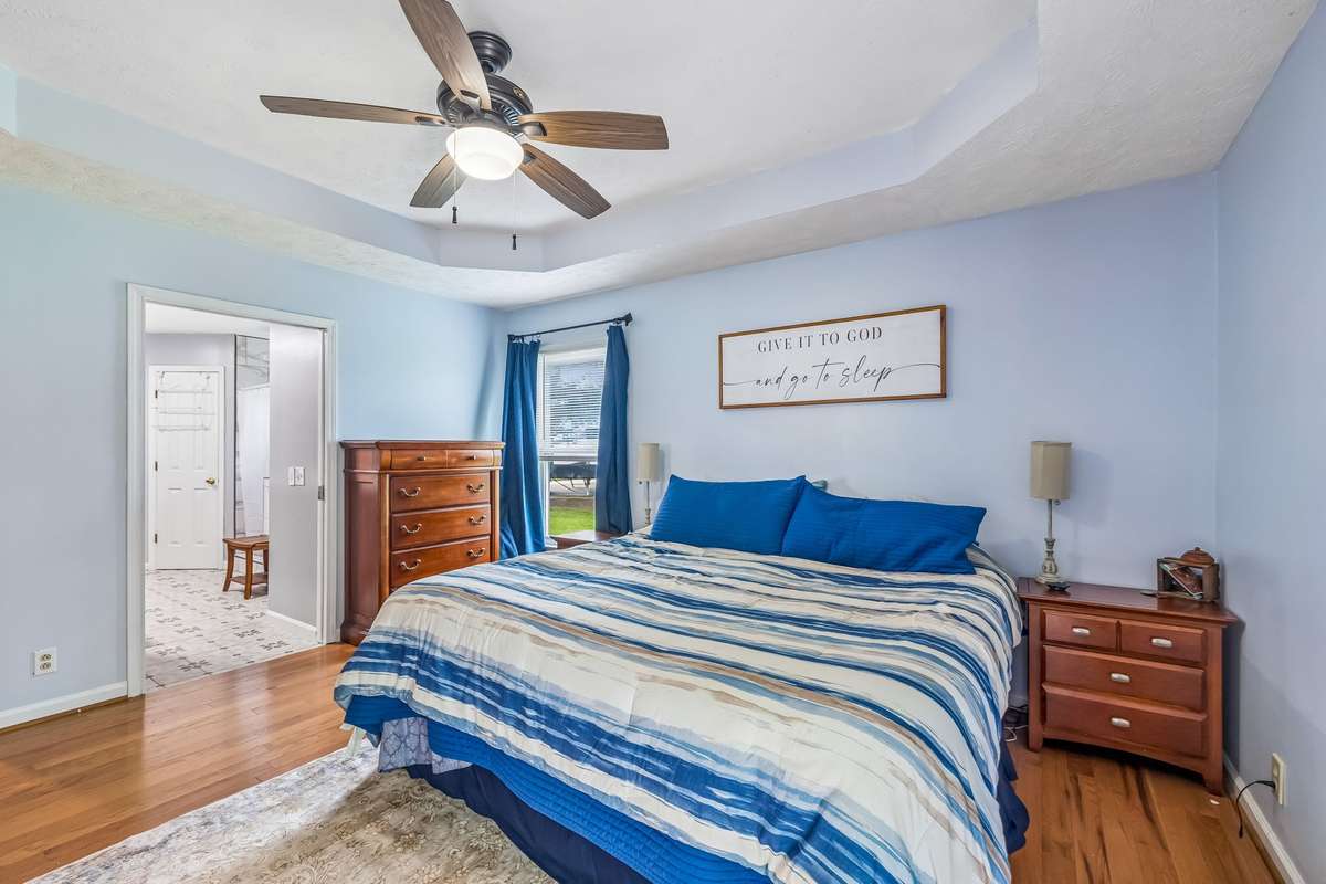 Bathroom access and closets to one side gives this primary bedroom a nice private flow.