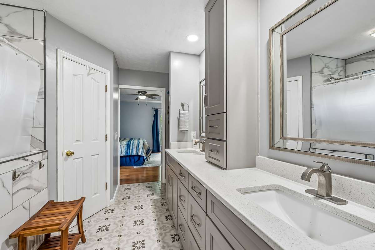 Plenty of storage in the tower cabinet and double vanity drawers, everything has a place without cluttering the countertops.