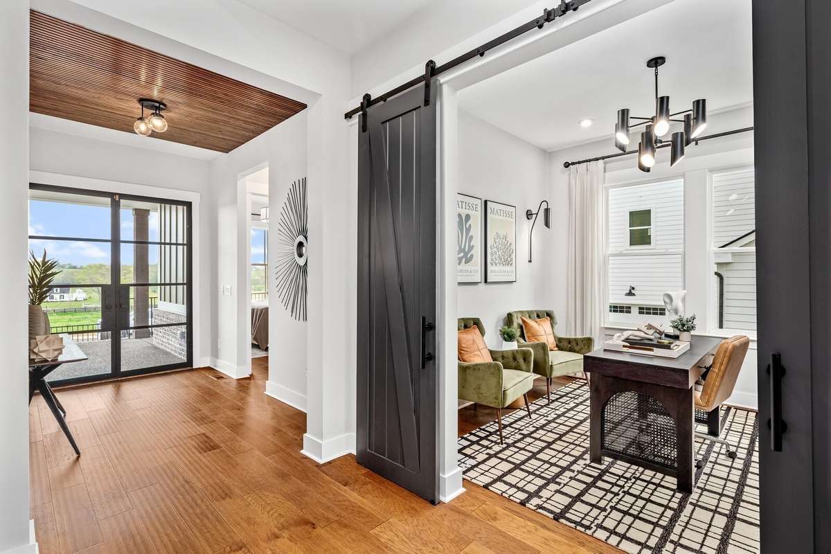 A Home Office is located on the main level in addition to a Guest suite.  All photos with furnishings are from a former Marshall model home and are not the home for sale. They are a likeness.