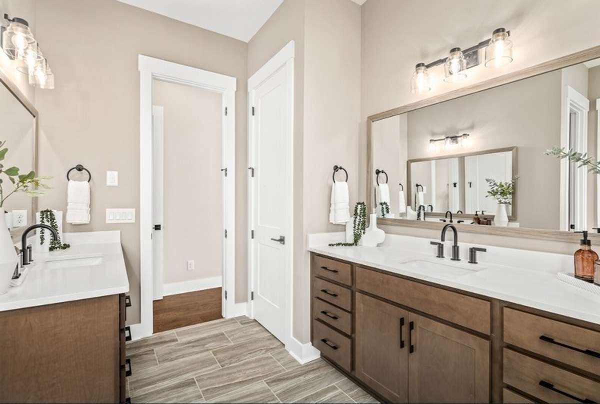 The Primary bath of the home being built is larger than what is shown.  All photos with furnishings are from a former Marshall model home and are not the home for sale. They are a likeness.