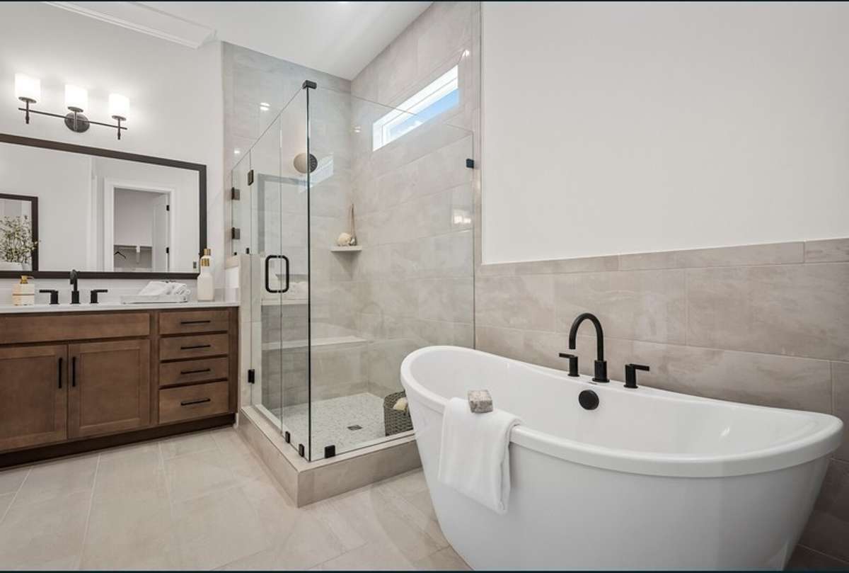 The Primary bath of the home being built will have a larger Primary bath than what is shown. All photos with furnishings are from a former Marshall model home and are not the home for sale. They are a likeness.