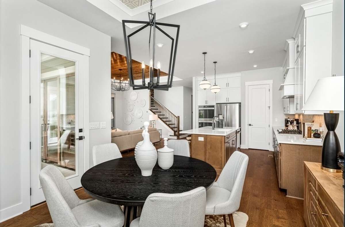 The Dining room is located at the rear of the home. All photos with furnishings are from a former Marshall model home and are not the home for sale. They are a likeness.