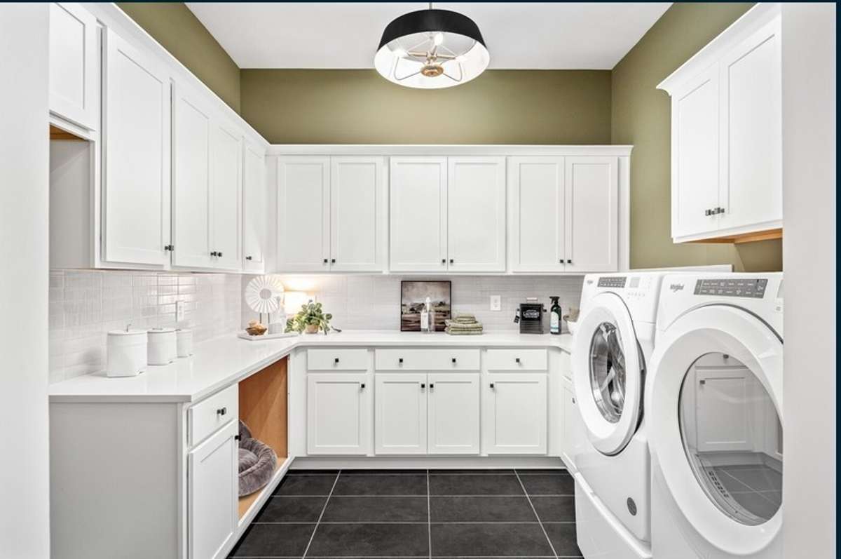 The Family Ready room offers a surplus of cabinets, water connection for a second refrigerator and washer/dryer connections. All photos with furnishings are from a former Marshall model home and are not the home for sale. They are a likeness.