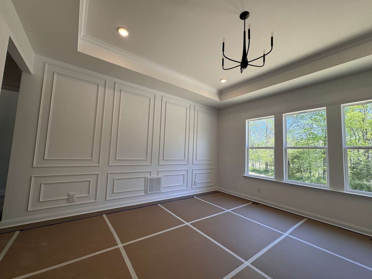Primary bedroom is located on the main level with beautiful trim!