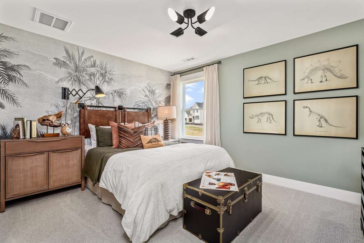 One of three upstairs bedrooms.  All photos with furnishings are from a former Marshall model home and are not the home for sale. They are a likeness.