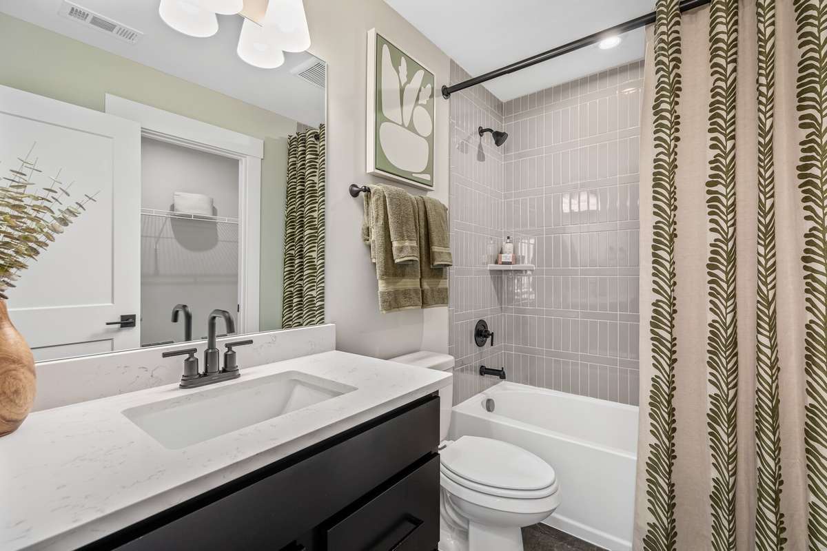 A second full bath on the second level.  All photos with furnishings are from a former Marshall model home and are not the home for sale. They are a likeness.