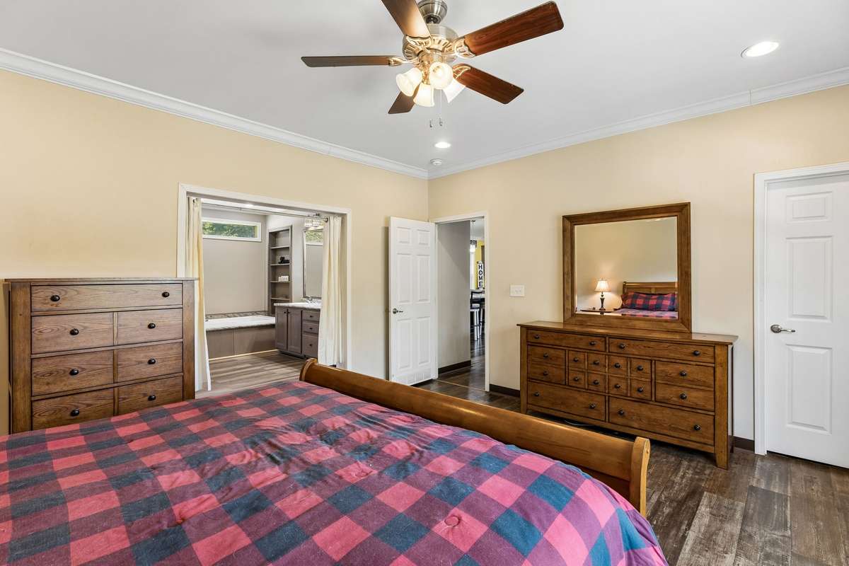 Off of the living area is the owners suite, complete with walk in closet and full bath