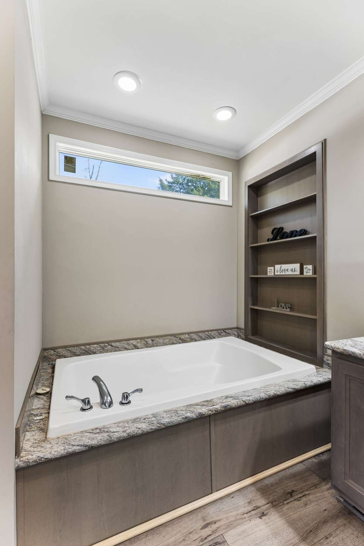 Large soaking tub with shelving