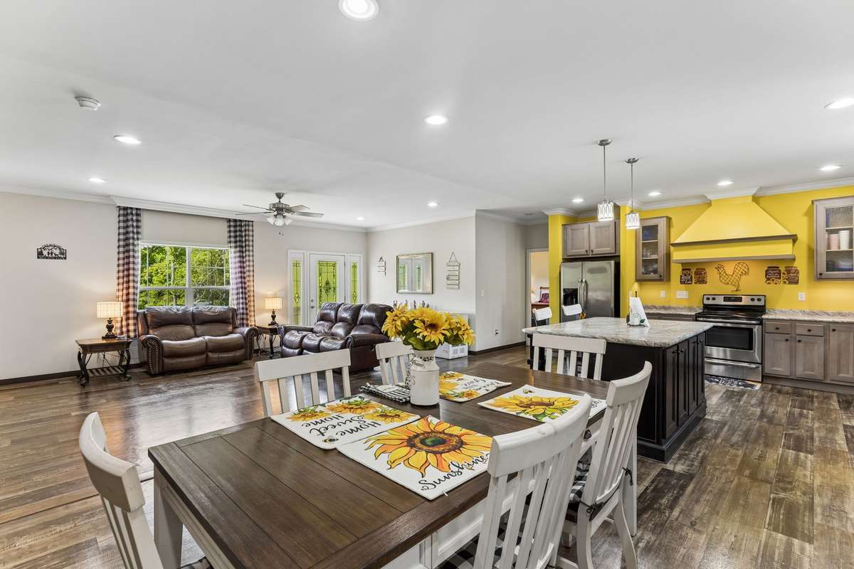 Across from the living area is the dining/kitchen combo. No matter where you are you can enjoy the conversation when having family get togethers.