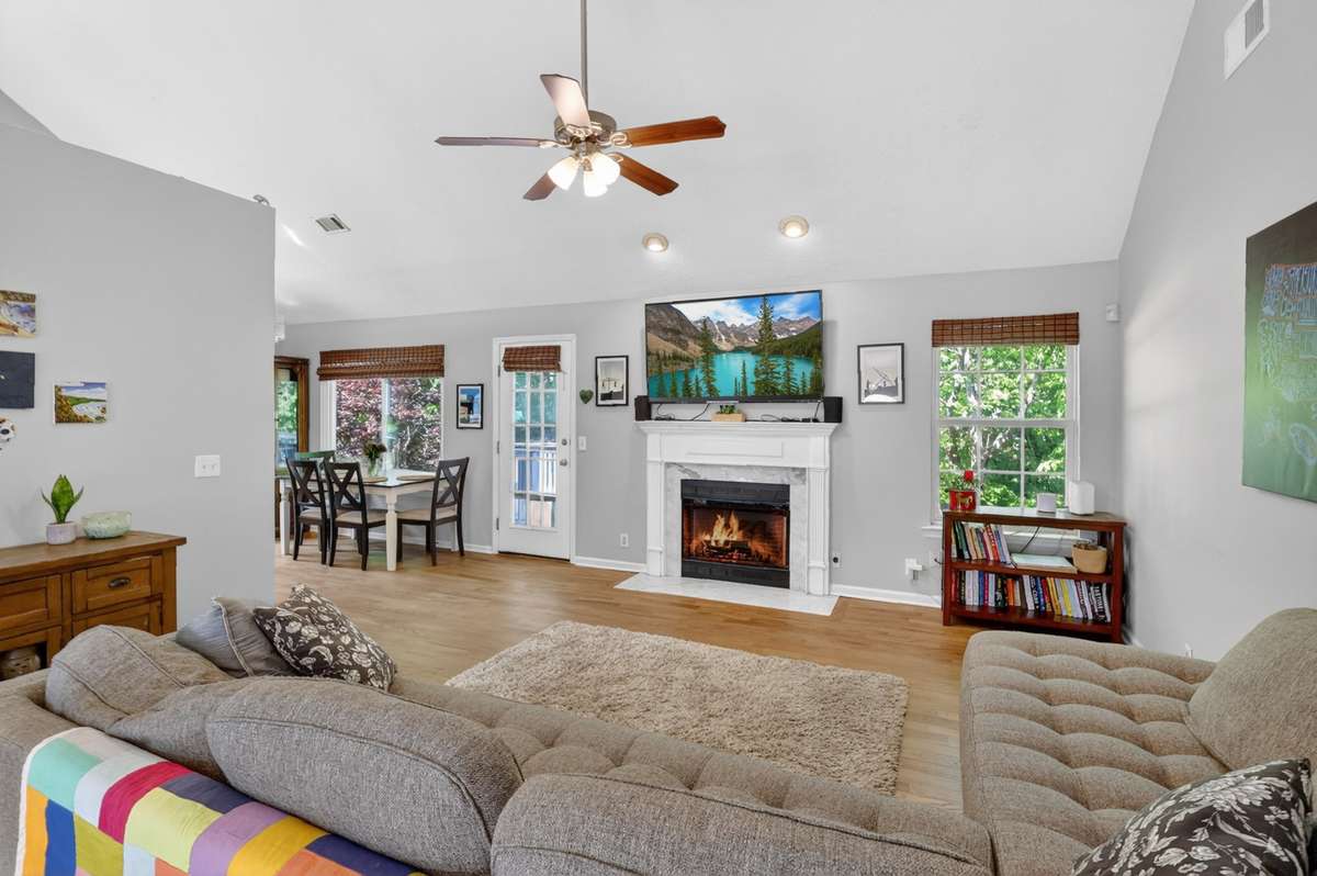 The living room flows into the eat-in area of the kitchen