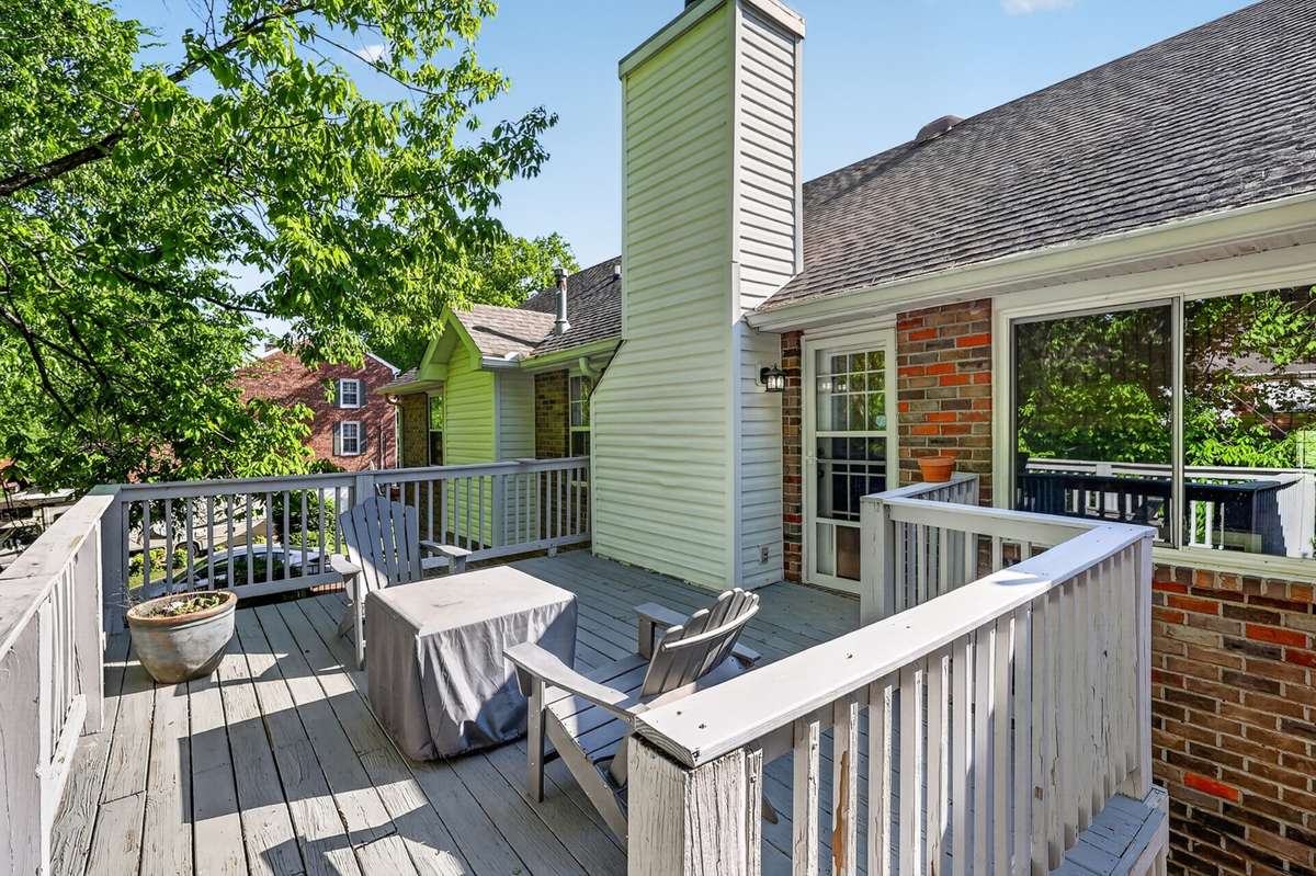 The back deck is perched among the trees