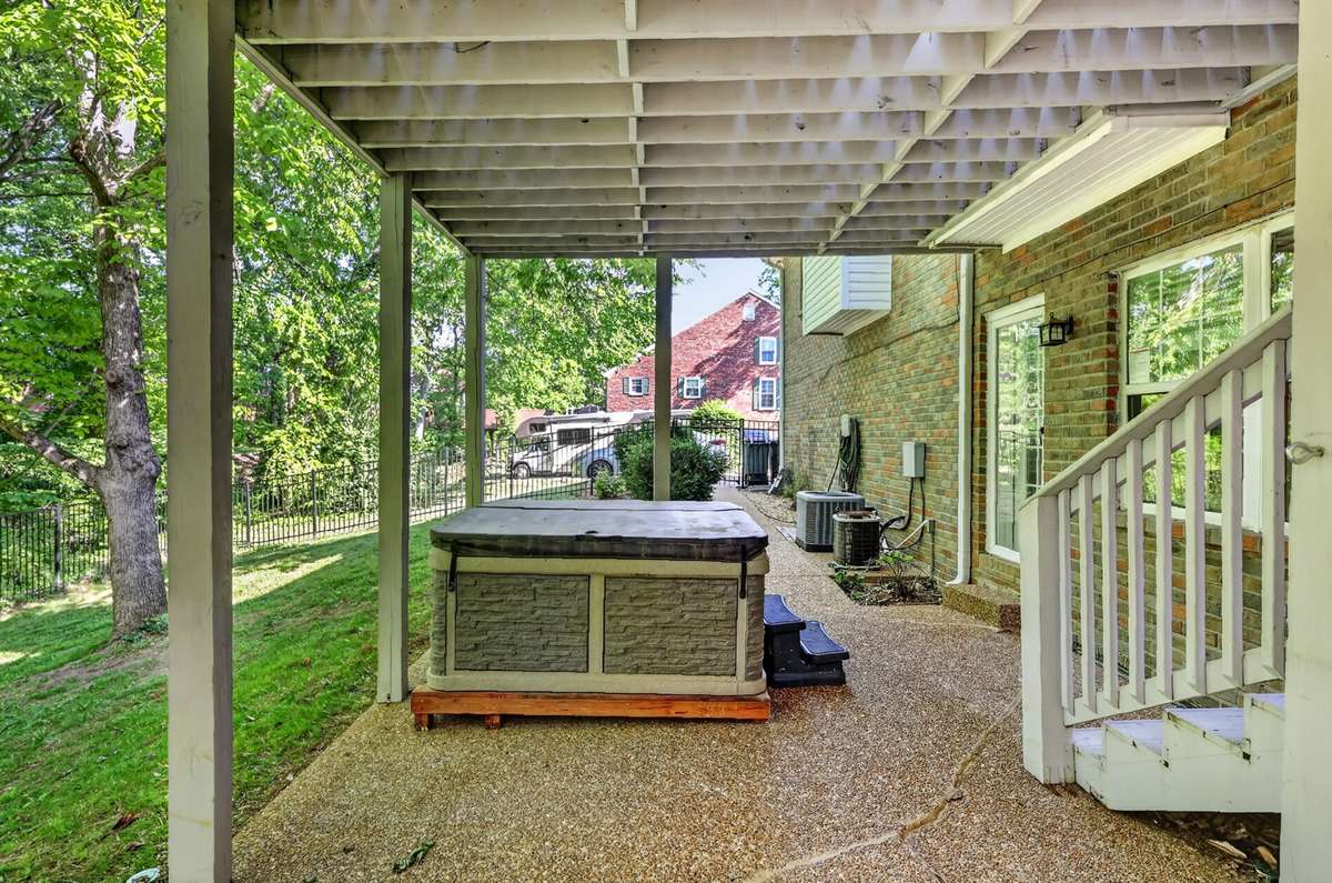 another view of this great outdoor space! Perfect for a porch swing and enjoying the breeze!