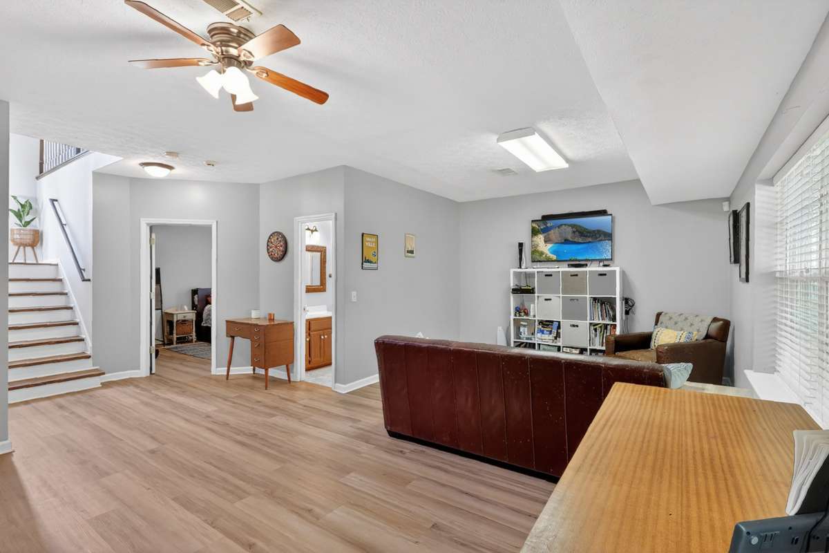 This space also hosts a full bedroom and bathroom, large pantry and laundry room, garage and outside (hot tub) access