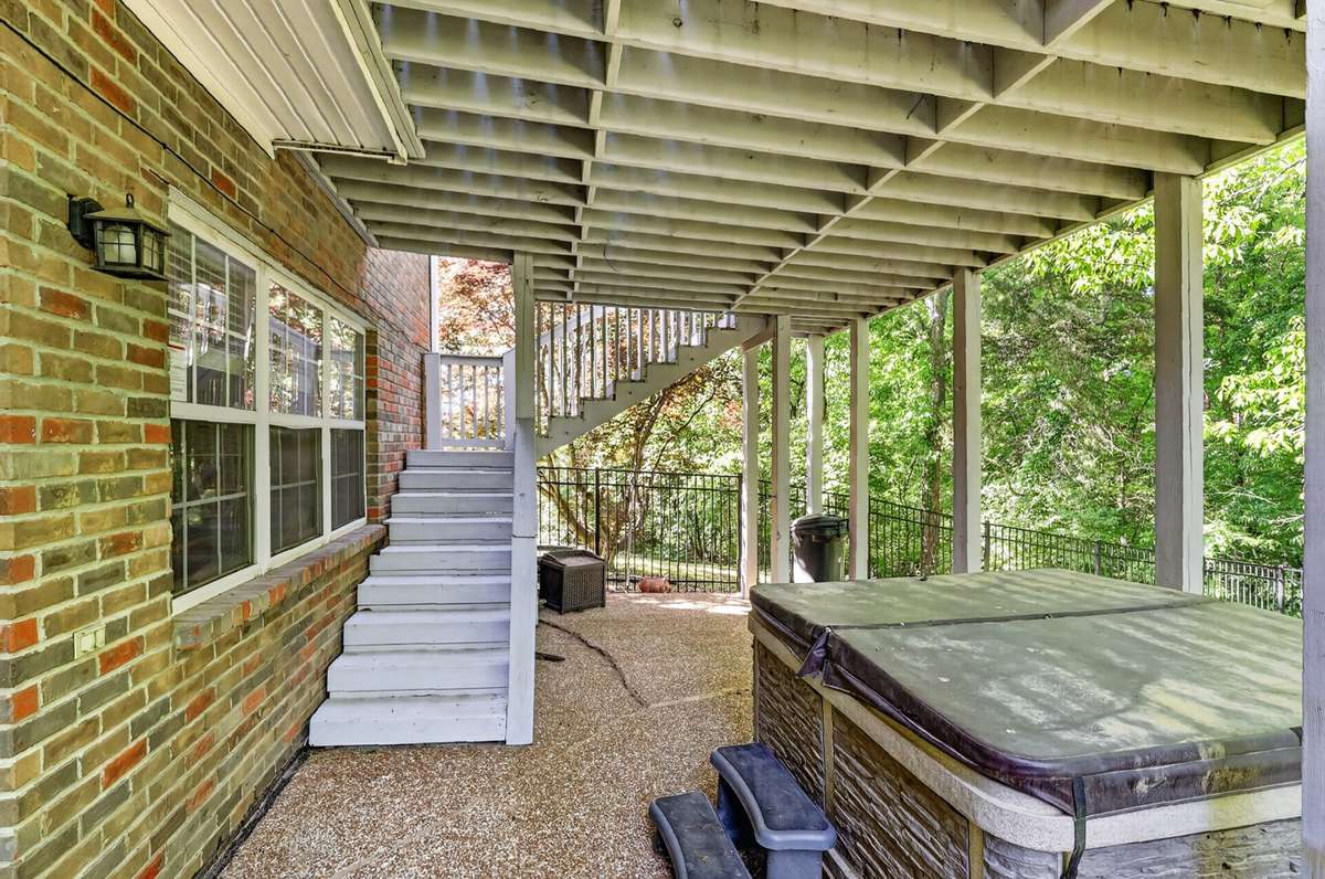 The patio under the deck is a great place to gather and enjoy the hot tub!