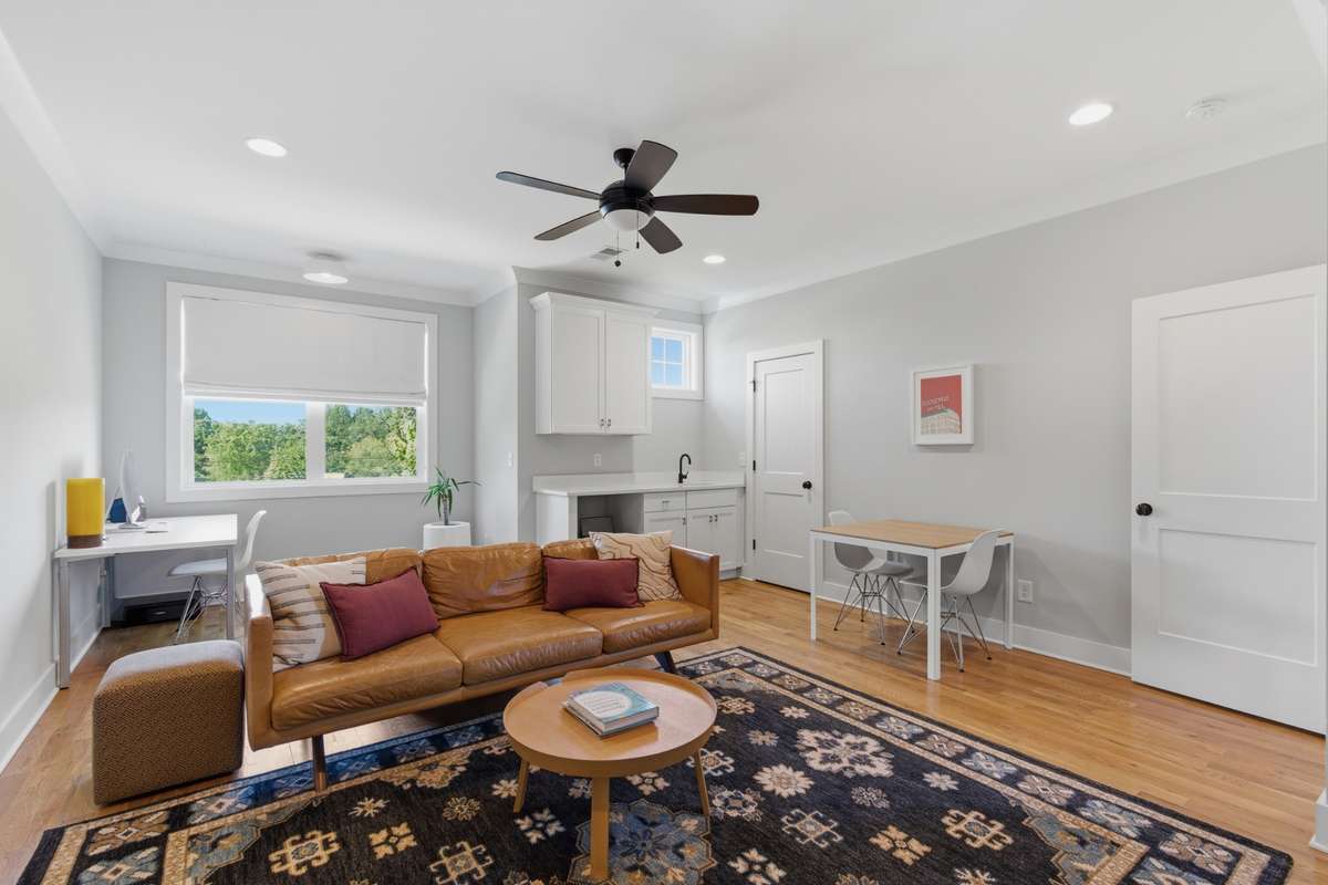 Continue upstairs to the spacious bonus room. A built-in wetbar is the perfect feature for movie or game nights!