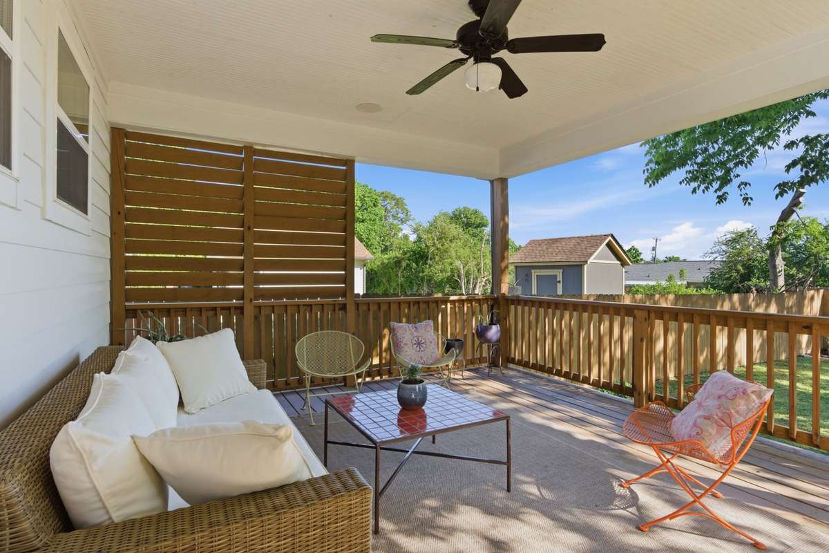 The covered porch creates a backyard oasis, perfect for savoring warm spring evenings!