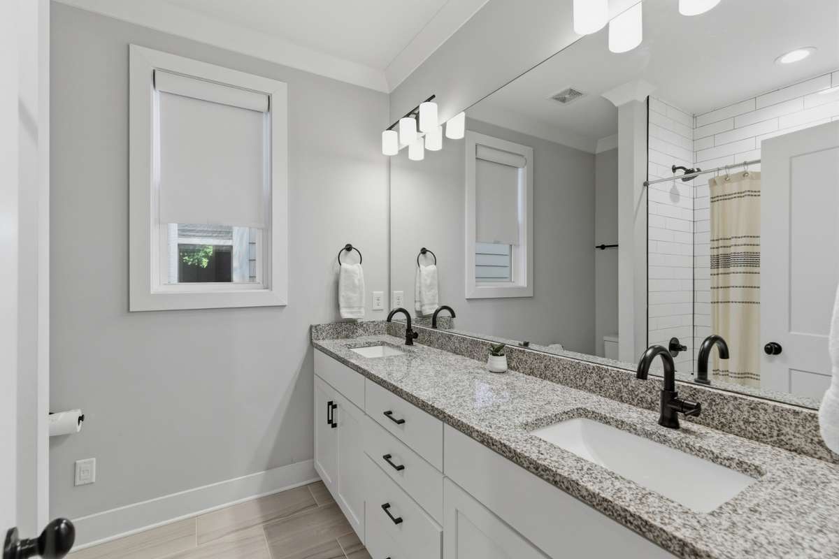Another lovely full bath is easily accessible to both guest bedrooms.