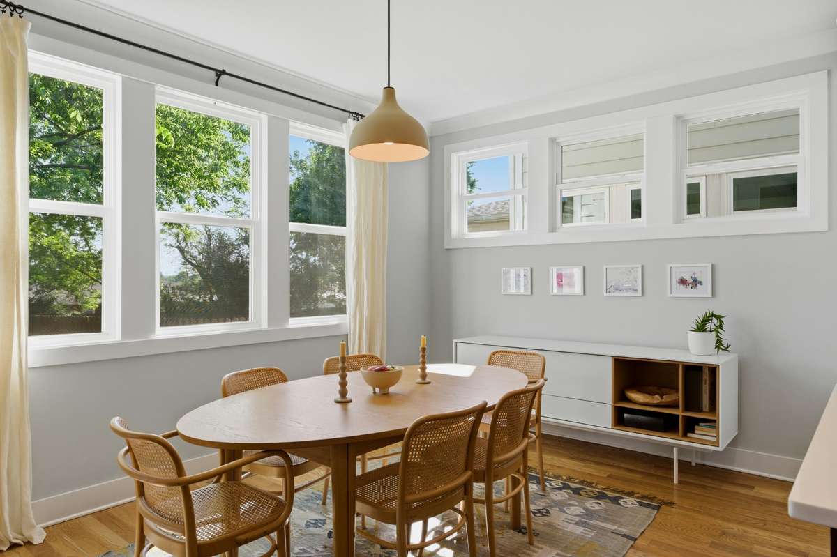 Abundant natural light fills the dining room! High windows preserve your privacy.
