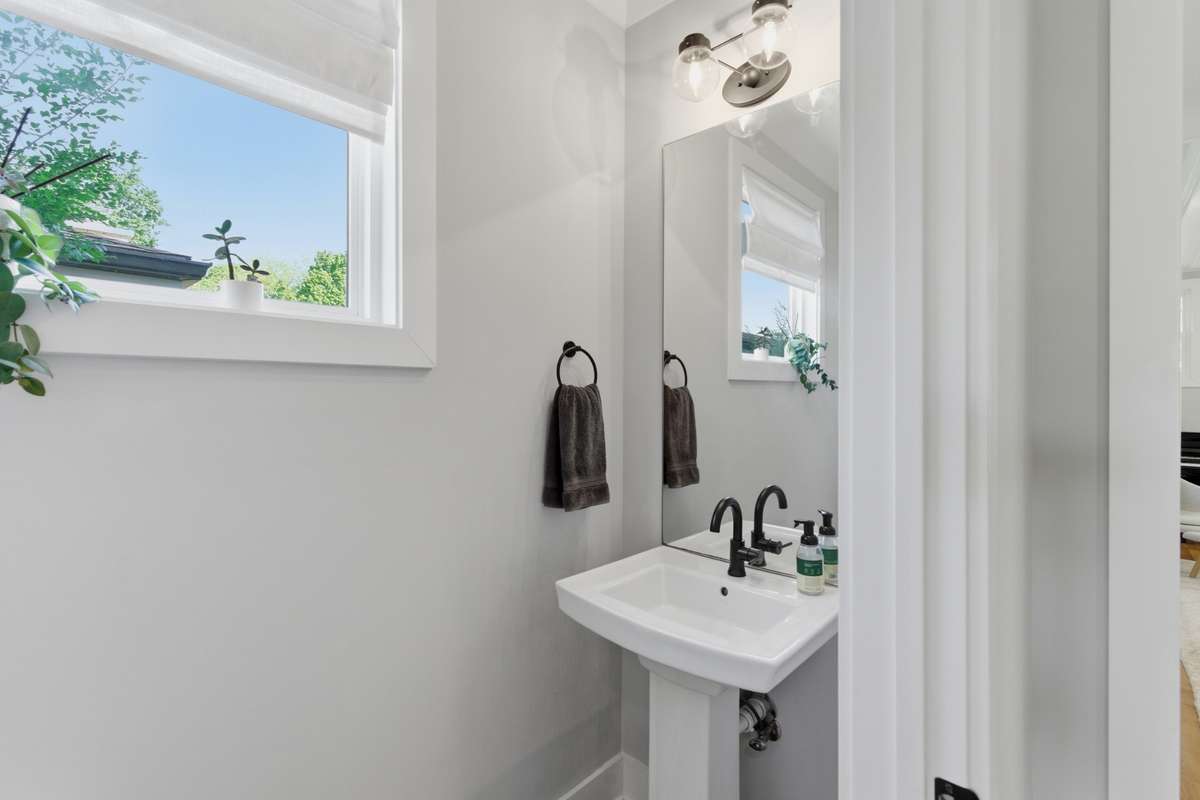 A convenient half bath is tucked away nearby.