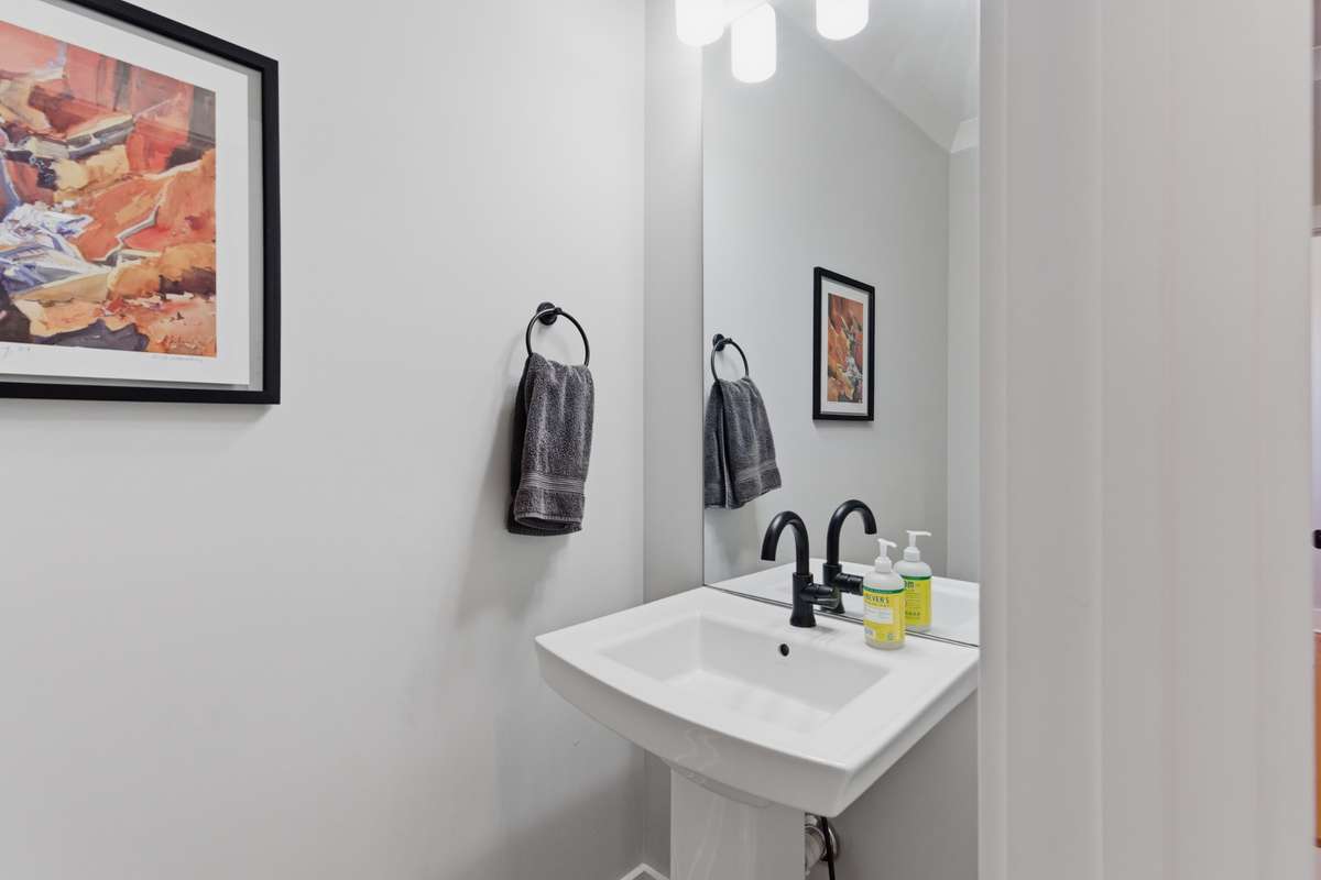 A second half bath sits near the bonus room.