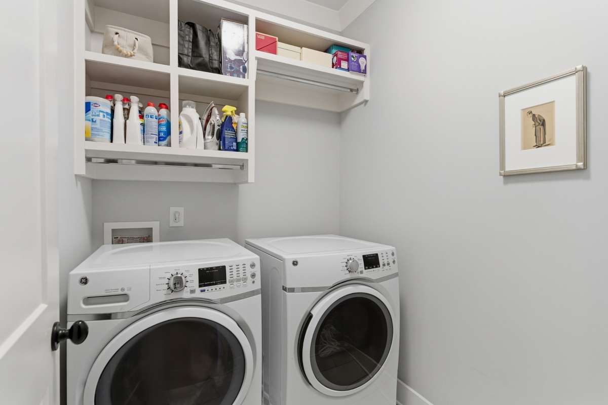 The laundry room is conveniently located close to the bedrooms, making everyday chores easier!
