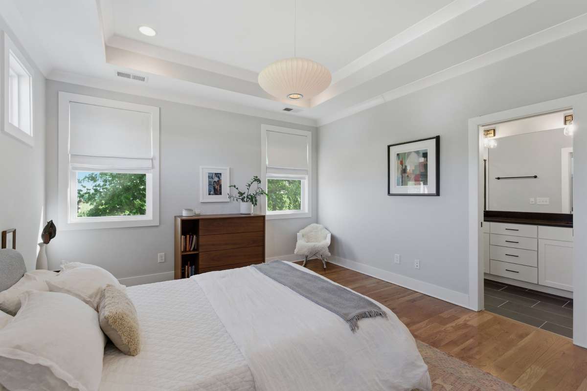 High tray ceilings draw your eye to the elegant chandelier.