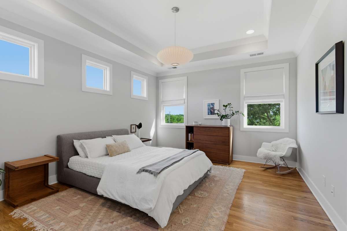 The sunlit primary bedroom will become your private escape!