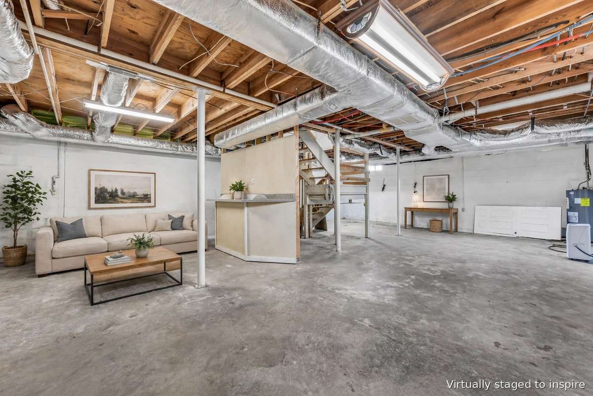 Large unfinished basement with windows and already plumbed for toilet