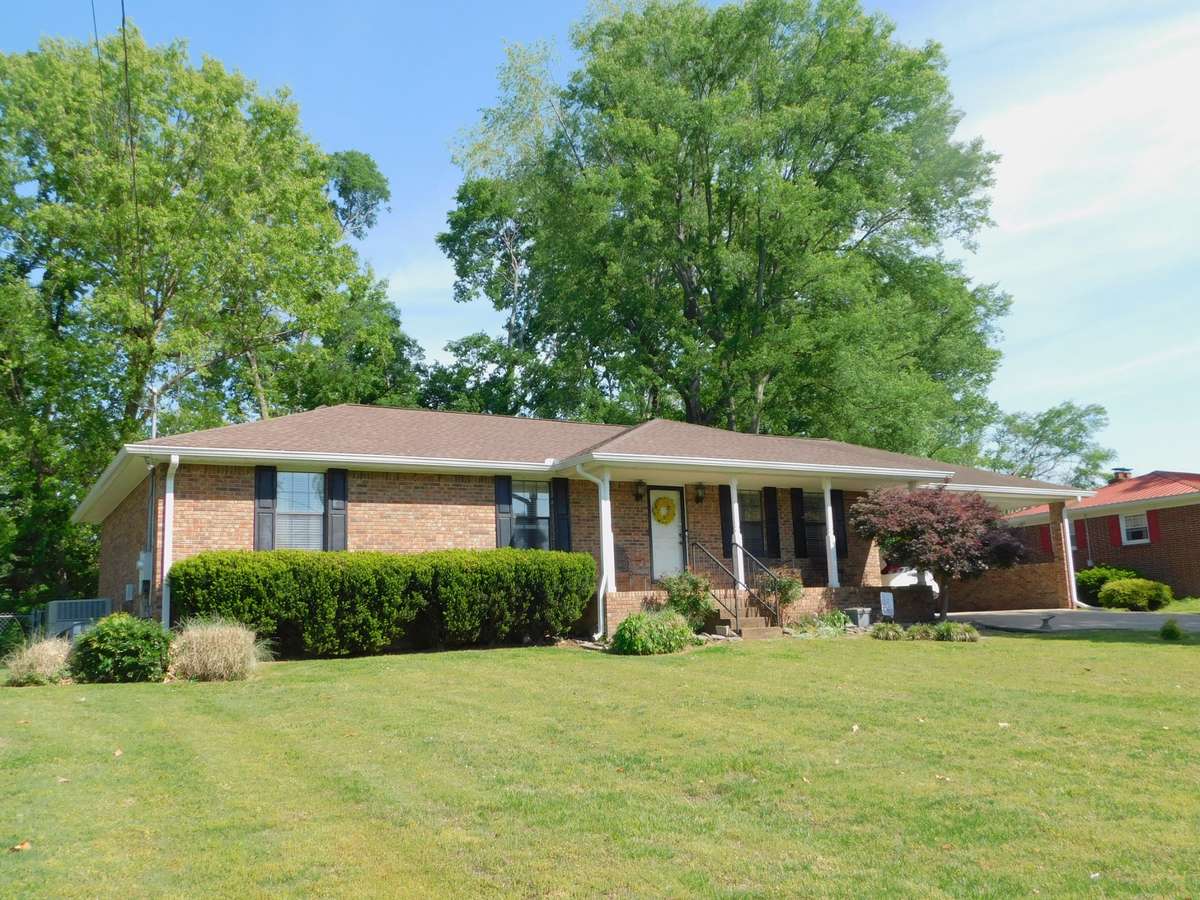 Stately All Brick Rancher sports a 2022 Newer Roof - Popular Single Story layout and No
 Association Fees