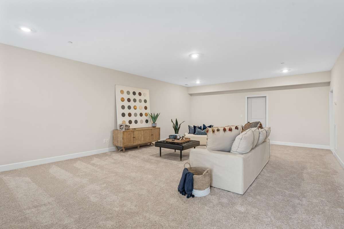 Lower level rec room has so many possibilities from ping pong table to pool table to room for gymnastics!