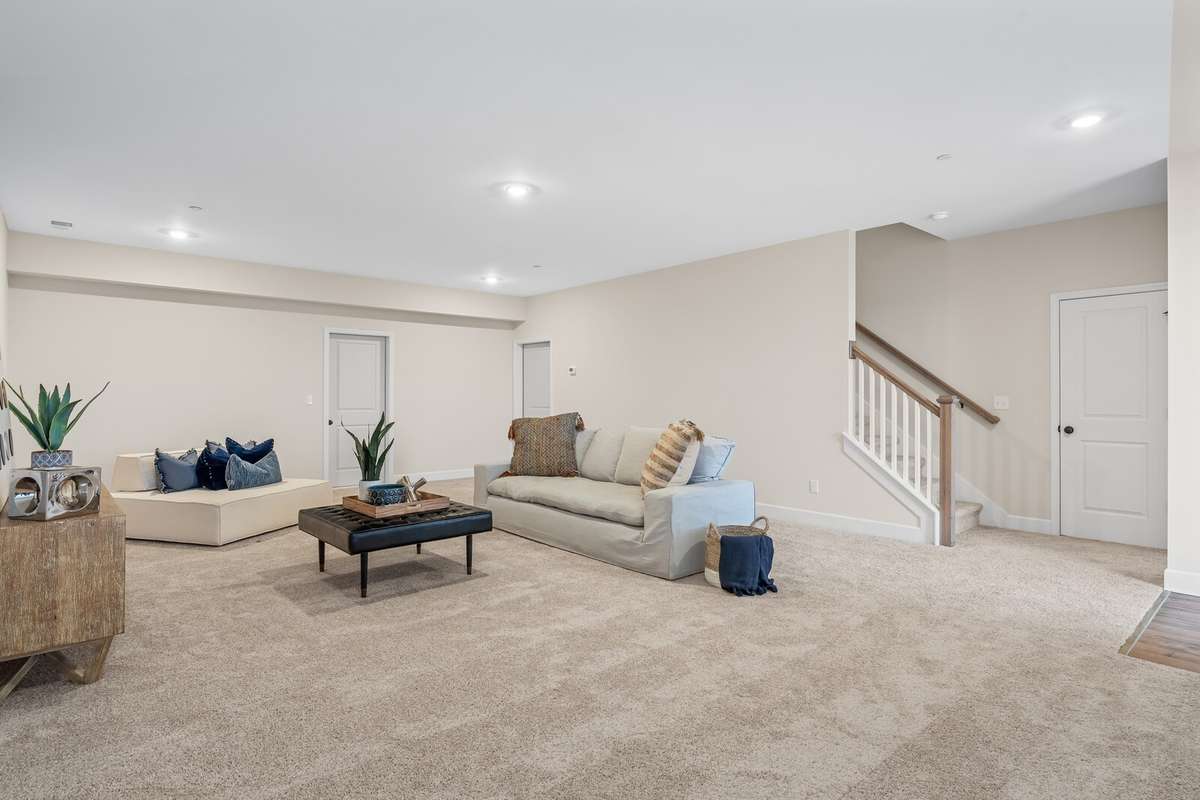 Amazing space in the lower level basement rec room plus there is an unfinished storage room as well.