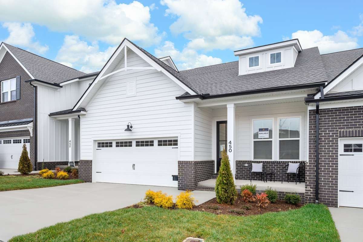 Two car attached garages and two parking spots on the driveway