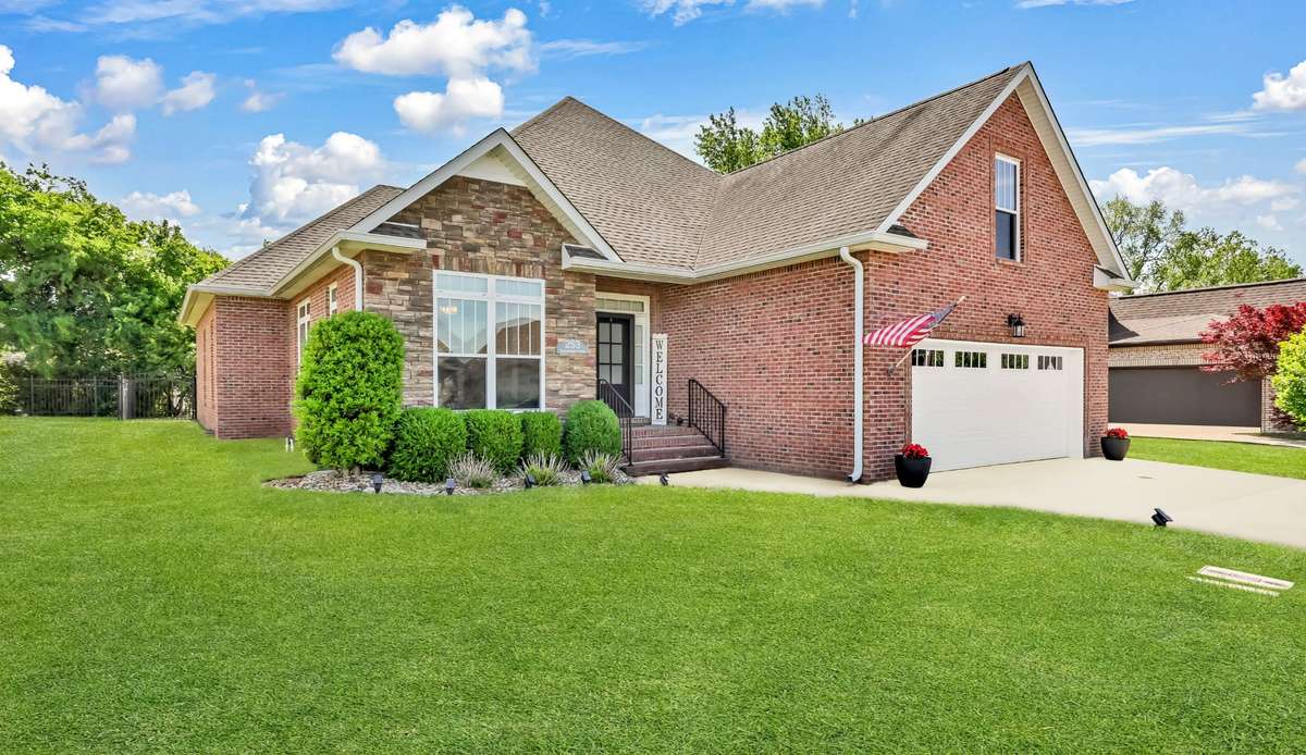 Luxury, privacy, and resort-style living in Sango. Located in a gated community just two doors from the clubhouse and pool, this all-brick home with stone accents delivers curb appeal and lifestyle.