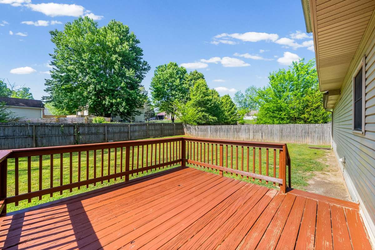 Deck and backyard with privacy fence