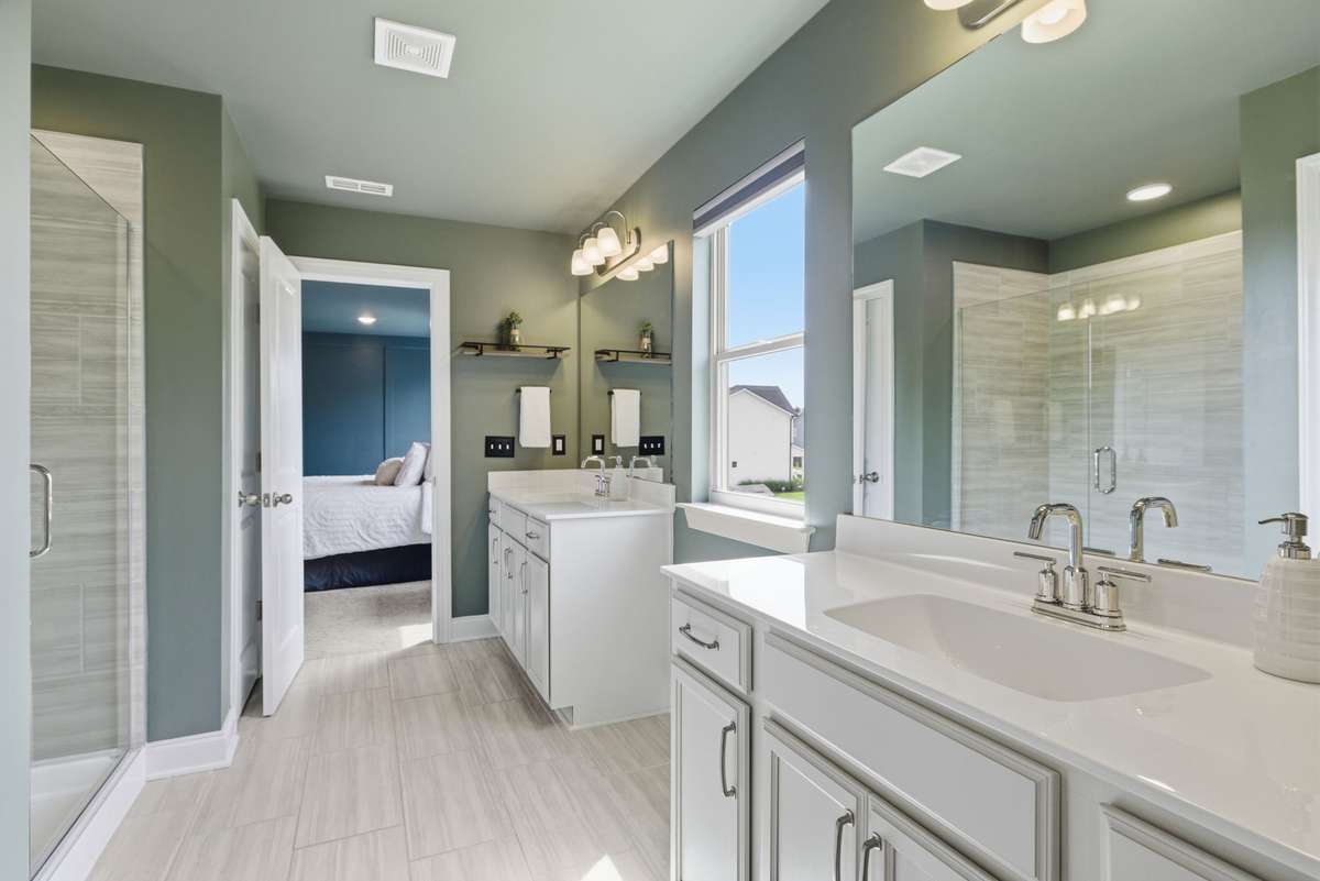 Spa-like primary retreat designed for relaxation, featuring the most soothing atmosphere and a spacious walk-in closet conveniently located just off the suite